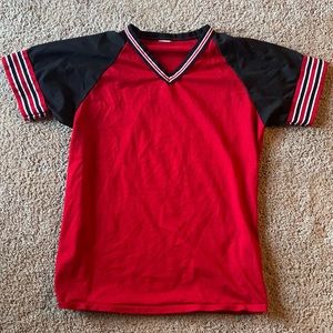Red penny material jersey shirt.